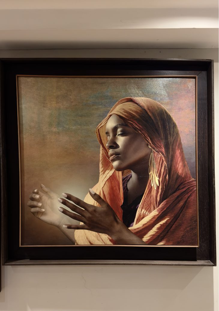 Woman in an orange veil with open hands